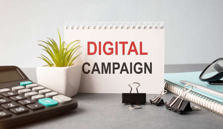 Notebook with Toolls and Notes about Marketing. DIGITAL CAMPAIGN textの写真素材