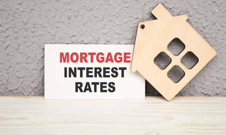 Mortgage Interest Rates text on a map. gray background with a house figureの写真素材
