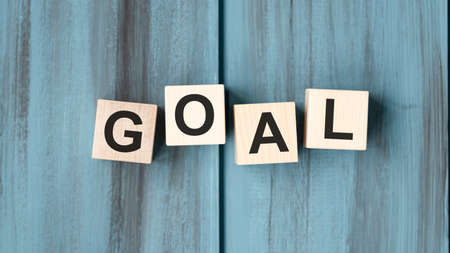 GOALS text on wooden cubes with winning cupsの写真素材