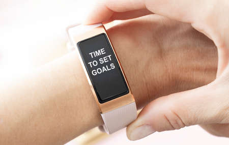 business, technology, internet and networking concept - businessman pressing time to set goals button on virtual screensの写真素材