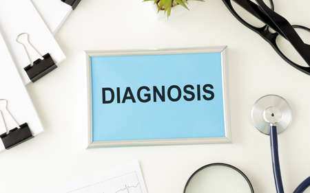 Diagnosis on white paper with medication injection, syringe and pills background copy space for your textの写真素材