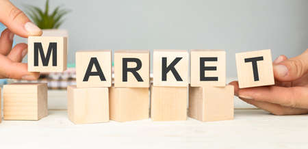 Market word written on wood block. Marketing text on wooden table for your desing. , Business commercial concept.の写真素材