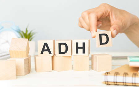 ADHD Abbreviation on ADHD cubes on a light background. Close ADHD - Attention Deficit Hyperactivity Disorder.の写真素材