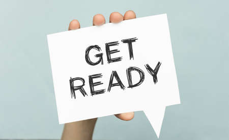 Get ready, message on business card shown by a businessman. Business risk management concept. Exams concept.の写真素材