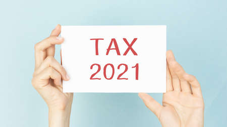 Hand writing inscription Tax 2021 with marker, conceptの写真素材