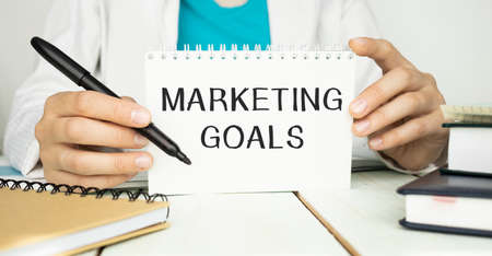 Notebook with Toolls and Notes about Marketing Goalsの写真素材