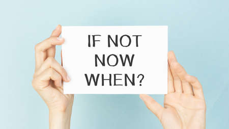 If Not Now When card with colorful background with defocused lightsの写真素材