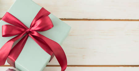 Top view two gift boxes on a blue wooden background in vintage style with copy spaceの写真素材