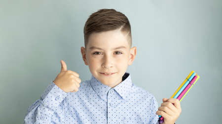 Back to school. Happy smiling boy. Child from elementary school in uniform. Funny kid