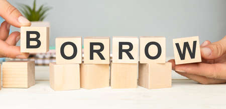the word of BORROW on wooden cubesの写真素材