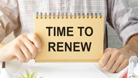 TIME TO RENEW paper on the card, business concept, business ideaの写真素材