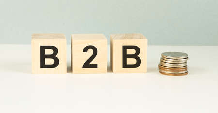 B2B, business to business marketing, business word on wooden cubes over blur background, banner, with copy space for textの写真素材