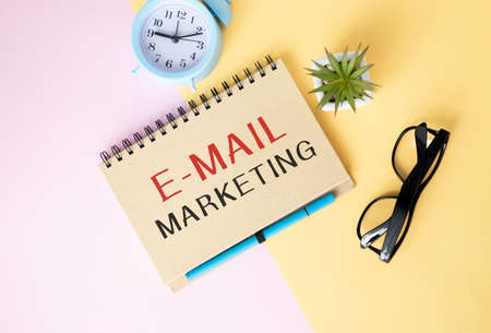 E-mail Marketing concept on notebook with envelopes and laptopの写真素材
