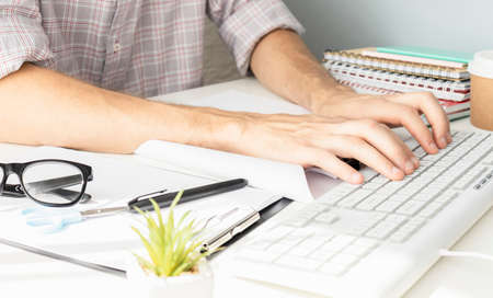 designer moving hands working with laptop computer and digital web design diagram as conceptの写真素材