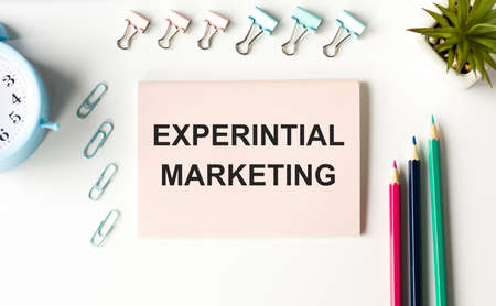 Conceptual handwriting showing Experiential Marketing Text on notepad.