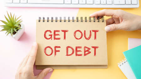Paper note with text Get Out Of Debtの写真素材