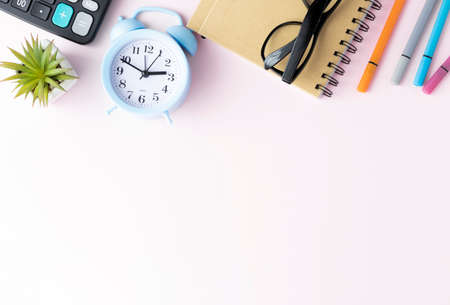 feminine banner or shop header with office writing supplies, technical gadgets, smartphone and a...