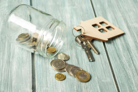 Glass jar with euro coins scattered. Finansial concept.の写真素材