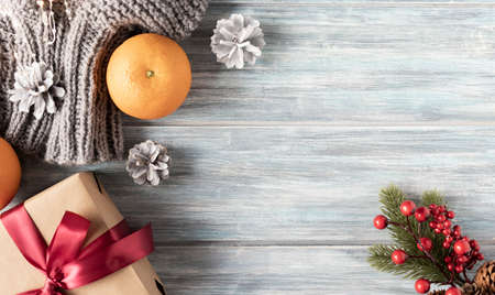 Christmas garland decoration placed on wooden planks. Copyspace for text