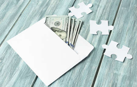 Close up of money in envelope are lying on the table