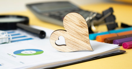 Wooden hearts on paper background, office deskの写真素材