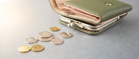 Construction crane models, calculator, coins in currency glass jars on the table. Saving money for future retirement. Home mortgage loan rate. Real estate development or property investmentの写真素材