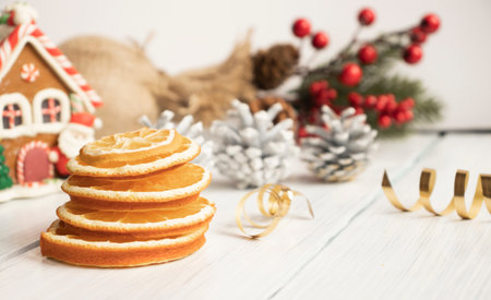 Top view of christmas spices on wooden background with fir branches and copy spaceの写真素材