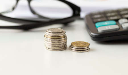 Coins stacked on each other, close up picture, market crisis and fragile market