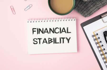 Financial stability text written in a notebook. View from aboveの写真素材