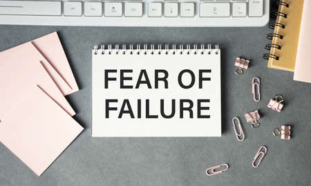 text fear of failure, isolated white background with printer and folders.business conceptの写真素材