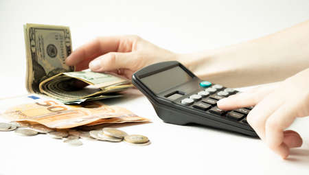 Woman doing accounting home finance expenses and calculate credit card monthly debt to bills...