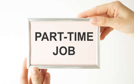 Businesswoman holding card with Part-time JOB message.の写真素材