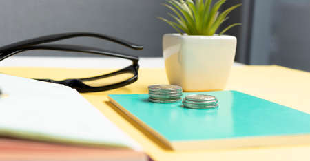Coins on a table. Business concept. Coins stacked in ascending order.の写真素材