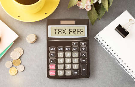 TAX FREE text on the calculator on the desktop, top view.の写真素材