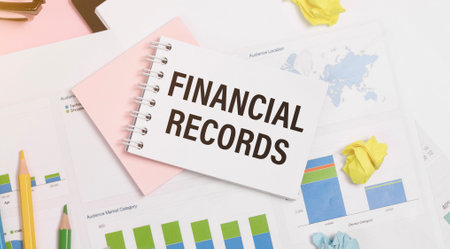 Paper with text Financial Records on a financial tables