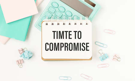 businesman hold notepad with text Time to compromise. White background. Business