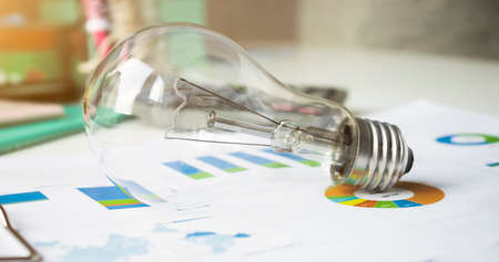 idea or light bulb and calculator on document