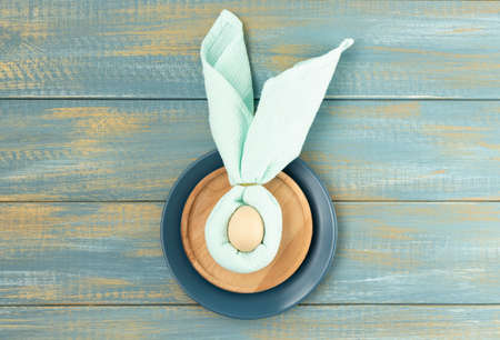 Beautiful festive Easter table setting with napkin Easter Bunny