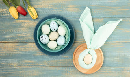 Beautiful festive Easter table setting with napkin Easter Bunny