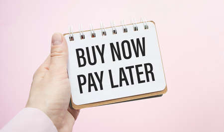 Buy now pay later text concept write on notebookの写真素材