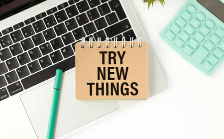 Try New Things card on pink background office deskの写真素材