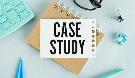 Case study memo written on a notebook with pen and cflculatorの写真素材
