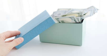 Gift Box With Banknote Of Dolla and hand.