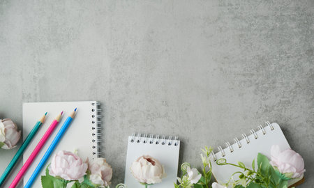 Slate Board Decorated With Petals And Pink Flowers Of Peonies On A Gray Concrete Background Withの写真素材