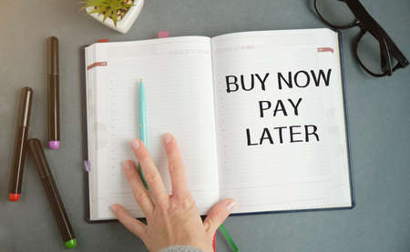 Buy now pay later text concept write on notebookの写真素材