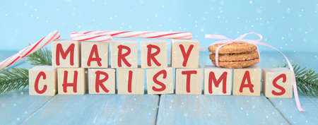 Christmas or new year background, text christmas decoration on cubes cones, snowflakes and fir...