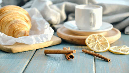 French Breakfast with Croissants and Coffee on wooden background.