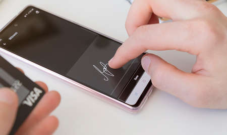 Electronic signature, Business and technology concept. Businessman working on digital tablet signing contract.の写真素材