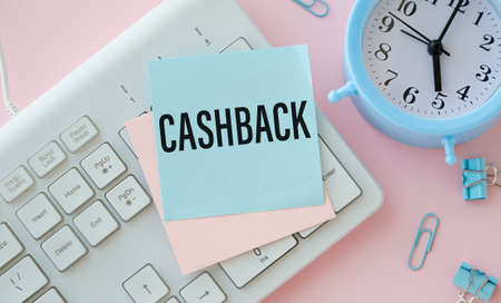 CASHBACK text on a sticker on your desktop. Diary and magnifier. financial concept.の写真素材