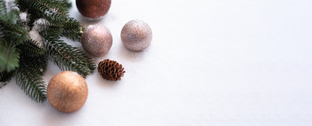 Christmas Tree Pine Branches and Christmas balls on a light background.の写真素材